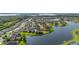 Stunning aerial view of a lakeside community with lush landscaping and beautiful homes at 1760 Boat Launch Rd, Kissimmee, FL 34746