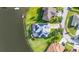 Enjoy lakefront living in this home with a private, screened-in pool and energy-efficient solar panels at 1760 Boat Launch Rd, Kissimmee, FL 34746