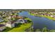 Waterfront homes with lush green lawns lead to a serene lake in a beautiful suburban community at 1760 Boat Launch Rd, Kissimmee, FL 34746