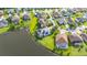 Beautiful lakefront property with screened-in pool, lush landscaping, and solar panels for energy efficiency at 1760 Boat Launch Rd, Kissimmee, FL 34746