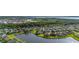 High-angle shot shows houses with picturesque lake views offering peaceful residential living at 1760 Boat Launch Rd, Kissimmee, FL 34746