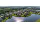 Beautiful aerial view of waterfront homes in a suburban community near a lake and a forested area at 1760 Boat Launch Rd, Kissimmee, FL 34746
