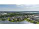 Panoramic aerial scene of a community bordering a lake, complemented by lush greenery at 1760 Boat Launch Rd, Kissimmee, FL 34746