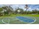 Enjoy outdoor recreation on this full-sized basketball court with mature trees at 1760 Boat Launch Rd, Kissimmee, FL 34746