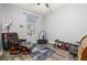 This flex bedroom space features gray walls, hardwood floors, lots of natural light, and workout equipment at 1760 Boat Launch Rd, Kissimmee, FL 34746