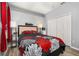 Bedroom features gray walls, hardwood floors, ceiling fan, and a bed with a floral print comforter at 1760 Boat Launch Rd, Kissimmee, FL 34746