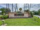 Welcome to The Oaks Golf Club & Community, a neighborhood with manicured landscaping and mature palms at 1760 Boat Launch Rd, Kissimmee, FL 34746