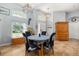 Dining space with tile floors, natural light, and a view towards the front door at 1760 Boat Launch Rd, Kissimmee, FL 34746