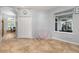 Tiled hallway featuring neutral paint, a double door closet and a view into another room at 1760 Boat Launch Rd, Kissimmee, FL 34746