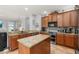 Updated kitchen features granite countertops, stainless steel appliances, and an open floorplan at 1760 Boat Launch Rd, Kissimmee, FL 34746