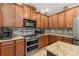 Updated kitchen features granite countertops, stainless steel appliances, and tiled backsplash at 1760 Boat Launch Rd, Kissimmee, FL 34746