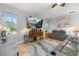 Spacious living room with a ceiling fan, a large television, and a comfortable seating area at 1760 Boat Launch Rd, Kissimmee, FL 34746
