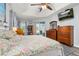 Well-lit main bedroom boasts wood floors, tray ceiling, and sliding glass doors to the outdoor area at 1760 Boat Launch Rd, Kissimmee, FL 34746