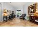 Home office with tile flooring, a desk setup, and sliding glass doors leading to the outdoors at 1760 Boat Launch Rd, Kissimmee, FL 34746