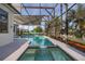 Serene spa and pool area enclosed in screened lanai with scenic views at 1760 Boat Launch Rd, Kissimmee, FL 34746