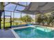 Enjoy swimming in this screened-in pool with relaxing lake views at 1760 Boat Launch Rd, Kissimmee, FL 34746