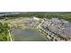 A beautiful aerial view showing the neighborhood's ponds, roads, trees, and mixed-use buildings at 1801 Coastal Ct, Celebration, FL 34747