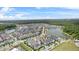 Gorgeous aerial view featuring the community, lakes, and surrounding natural landscape at 1801 Coastal Ct, Celebration, FL 34747