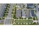 Aerial view showcasing meticulously planned neighborhood layout with charming homes, trees and streets at 1801 Coastal Ct, Celebration, FL 34747