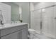 Modern bathroom with stylish vanity, glass-enclosed shower, and tile accents at 1801 Coastal Ct, Celebration, FL 34747