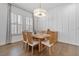 Bright dining room with natural light and wood floors at 1801 Coastal Ct, Celebration, FL 34747