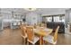 Open concept dining room features a view of the kitchen and slider doors at 1801 Coastal Ct, Celebration, FL 34747