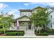 Charming two-story home with a welcoming porch, manicured landscaping and inviting curb appeal at 1801 Coastal Ct, Celebration, FL 34747
