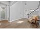 Bright foyer with hardwood floors, high ceilings, and an adjacent bathroom with a glass door shower at 1801 Coastal Ct, Celebration, FL 34747