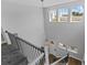 Elegant foyer showcasing the staircase, chandelier, and natural light from the windows at 1801 Coastal Ct, Celebration, FL 34747
