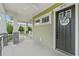 Inviting porch with ceiling fans and comfortable seating for relaxing at 1801 Coastal Ct, Celebration, FL 34747