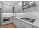 Contemporary kitchen with stainless steel appliances, sleek countertops, and modern cabinetry at 1801 Coastal Ct, Celebration, FL 34747
