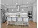 Contemporary kitchen with stainless steel appliances, a large island with seating, and ample cabinet space at 1801 Coastal Ct, Celebration, FL 34747