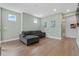 Comfortable living area with a gray sectional couch and well-lit ambiance at 1801 Coastal Ct, Celebration, FL 34747