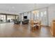 Open concept living and dining area featuring wood floors and slider doors at 1801 Coastal Ct, Celebration, FL 34747