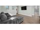Inviting living room featuring a gray sectional sofa and modern decor at 1801 Coastal Ct, Celebration, FL 34747