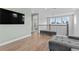 Bright loft featuring wood floors, black metal railing, sitting bench, and plenty of natural light at 1801 Coastal Ct, Celebration, FL 34747
