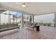 Spacious screened-in patio with outdoor furniture and ceiling fans at 1801 Coastal Ct, Celebration, FL 34747