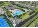 Aerial view showcases community center, pool, bocce ball, shuffleboard and tennis courts at 231 Lewis Dr, Davenport, FL 33837