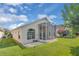 Spacious backyard featuring a screened-in lanai, perfect for outdoor relaxation and entertainment at 231 Lewis Dr, Davenport, FL 33837