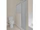 Bright bathroom with shower, toilet and tile flooring at 231 Lewis Dr, Davenport, FL 33837
