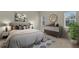 Comfortable bedroom with a queen-sized bed, modern furniture, dresser, and sunny windows at 231 Lewis Dr, Davenport, FL 33837