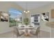 Cozy breakfast nook featuring a round table with seating for four and a large window overlooking the yard at 231 Lewis Dr, Davenport, FL 33837