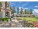 Beautiful community signage with manicured landscaping and a stone water feature at 231 Lewis Dr, Davenport, FL 33837