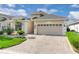 This home offers a spacious two-car garage and elegant landscaping, boosting curb appeal at 231 Lewis Dr, Davenport, FL 33837