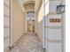 Charming entryway with decorative brickwork leading to the glass-paned front door at 231 Lewis Dr, Davenport, FL 33837