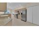 Well-equipped kitchen featuring stainless steel appliances and tiled floors at 231 Lewis Dr, Davenport, FL 33837