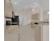 Spacious kitchen with granite countertops, stainless appliances, and tile flooring at 231 Lewis Dr, Davenport, FL 33837