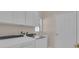 Laundry room featuring washer, dryer, storage, sink and door at 231 Lewis Dr, Davenport, FL 33837