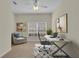 Bright office features a white desk, comfortable chair, neutral paint, and a large window with natural light at 231 Lewis Dr, Davenport, FL 33837