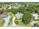 A stunning aerial view showcases the property's prime location, lake view, and neighborhood at 2376 Nightingale Ln, Kissimmee, FL 34746